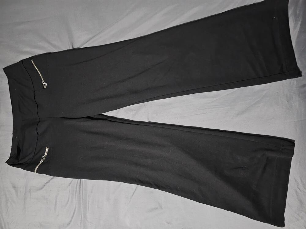 Black slim pants with zip front pockets